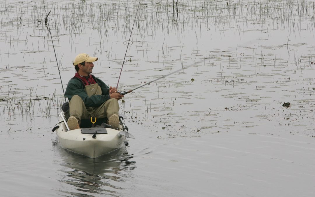 Angler on kayak fishing